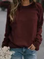 Close-up of a women's maroon long-sleeve round neck sweatshirt with soft fabric texture - S / Tops / Burgundy