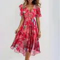 Elegant V-neck red floral dress featuring fluttering sleeves and a flowing asymmetrical hemline - S / Red
