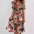 Close-up detail of women's elegant V-neck midi dress with vibrant multi-color floral print - S / Tops / Floral Print 4