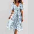 Full view of light blue floral V-neck dress with high-low hem and butterfly sleeves - S / Top And Bottom / Aqua