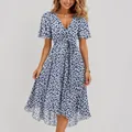 Stylish blue and white floral V-neck summer dress with belt detail on model - S / Bottoms / Blue White Floral