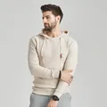 Close-up of beige men's jacquard hoodie sweater showing textured knit detail - S / Tops / Khaki
