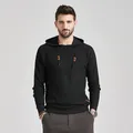 Detail shot of black men's jacquard hooded sweater with textured waffle knit pattern. - S / Tops / Black