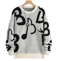 Detalle del tejido de punto y el patrón musical abstracto en este suéter de moda para hombre. - S / Tops / Negro y Blanco