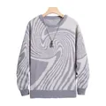 Macro view of grey swirl jacquard pattern on a men's loose knit crewneck sweater. - S / Tops / Gray