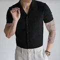 Professional men's black knitted short sleeve polo shirt with textured zigzag pattern - S / Tops / Black