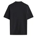 Back view of a black men's knitted short sleeve polo shirt with textured mesh pattern - S / Tops / Black
