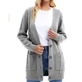 Detailed view of women's grey knitted cardigan featuring textured patterns and pockets - S / Tops / Light Gray