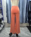 Detailed rear view of peach high-waisted wide-leg yoga pants displayed on a mannequin - XS / Bottoms / Orange