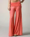 Detailed view of coral orange wide-leg yoga pants with a comfortable high waistband - XS / Bottoms / Orange