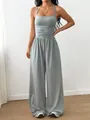 Detail view of a grey summer casual sleeveless wide-leg jumpsuit with halter neck. - Light Gray