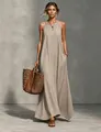 Full-length view of a khaki sleeveless halter maxi dress with a woven straw tote bag - Apricot