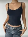 Detailed close-up of a navy blue slim-fit camisole featuring delicate lace trim and spaghetti straps - Navy Blue