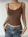 Close-up detail of the brown cropped camisole with delicate floral lace trim edging. - S / Tops / Brown