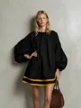 Loose black puff-sleeve doll dress featuring bold yellow stripes on the lower hemline - S / Tops / Black