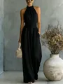 Elegante mono negro sin mangas con cuello halter y detalle de cintura ajustada. - S / Negro