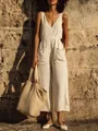 Elegant white cotton linen sleeveless V-neck jumpsuit with wide leg and pockets. - S / Top And Bottom / Apricot