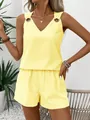 Yellow and white striped two-piece set with V-neck top and shorts on a female model. - S / Top And Bottom / Yellow