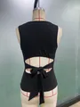 Detailed back view of black sleeveless tie-up tank top with cutout and bow on mannequin - S / Tops / Black