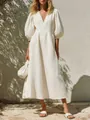 Full view of elegant white V-neck puff sleeve midi dress in a sunny vacation setting - S / Tops / White