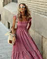 Close-up detail of a summer elegant red gingham smocked midi dress worn by a model. - S / Tops / Red