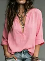 Detail of a casual pink V-neck blouse with a soft linen texture and layered necklaces - S / Tops / Pink