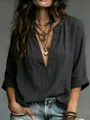 Close-up detail of women's dark grey linen-textured blouse with deep V-neck - S / Tops / Black