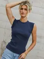 Close-up view of a women's navy blue sleeveless ribbed knit tank top on a stylish model - S / Tops / Navy Blue