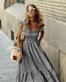 Close-up detail of the black and white gingham pattern and ruffled bodice on this summer dress - S / Tops / Black
