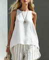 Detail view of white cotton linen sleeveless top with natural texture and loose fit. - White