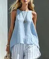 Model wearing a light blue sleeveless cotton linen top and striped casual shorts - S / Top And Bottom / Sky Blue