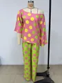 Completo a due pezzi a pois con top a spalle scoperte e pantaloni coordinati. - Taglia M / Top E Pantaloni / Colorato