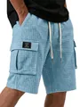 Close-up of men's light blue waffle-knit cargo shorts featuring pocket patch detail. - S / Bottoms / Sky Blue