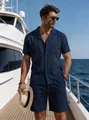 Model wearing navy blue linen summer set standing on yacht deck under clear blue sky - Navy Blue