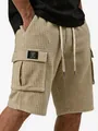Close-up detail of khaki waffle-knit men's cargo shorts featuring a pocket patch design - S / Bottoms / Khaki