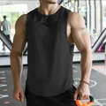 Professional close-up view of black quick-dry mesh tank top on athletic male in gym - M / Tops / Black