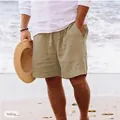 Pantaloncini da spiaggia gialli in cotone e lino con coulisse su sfondo mare estivo - Kaki
