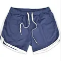 Close-up detail of high-performance breathable blue mesh sports shorts with white drawstring - M / Bottoms / Blue White Edge