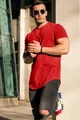 Detailed view of a men's loose red cotton T-shirt styled for urban casual wear - M / Tops / Red