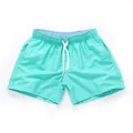Men's mint green beach shorts with elastic waist and white drawstring for summer surf - S / Bottoms / Cyan