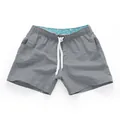 Men's stylish grey summer beach shorts featuring a white drawstring and cyan patterned lining - S / Bottoms / Gray
