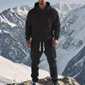 Detail showing men's black jacquard hooded sweatshirt and joggers set in a snowy landscape - S / Black