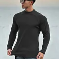 Detail shot of men's slim-fit muscle t-shirt with premium texture and mock neck - Black and Gray