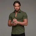 Close-up detail of olive green muscle fit stretch shirt with polo collar for men - Army Green