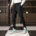 Men's winter fleece-lined joggers in black with elastic cuffs and drawstring waist - M / Bottoms / Black