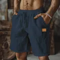 Detail view of breathable cotton linen men's casual shorts featuring drawstring waist. - S / Bottoms / Navy Blue