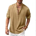 Close-up of casual khaki linen Henley shirt with stand collar and buttoned V-neck - Brown