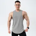 Detailed view of a grey cotton sports tank top on a muscular male model in a studio - M / Tops / Light Gray