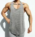 Close-up view of a grey marl gym stringer tank top for men showing an athletic muscle fit - M / Tops / Gray
