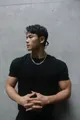 Close-up shot of a muscular male model wearing a black Sorona heavyweight crew neck T-shirt - M / Tops / Black